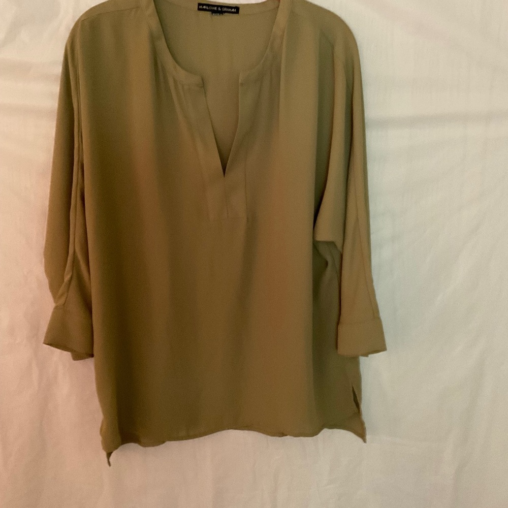 Slightly worn women’s blouse size large are 100% polyester